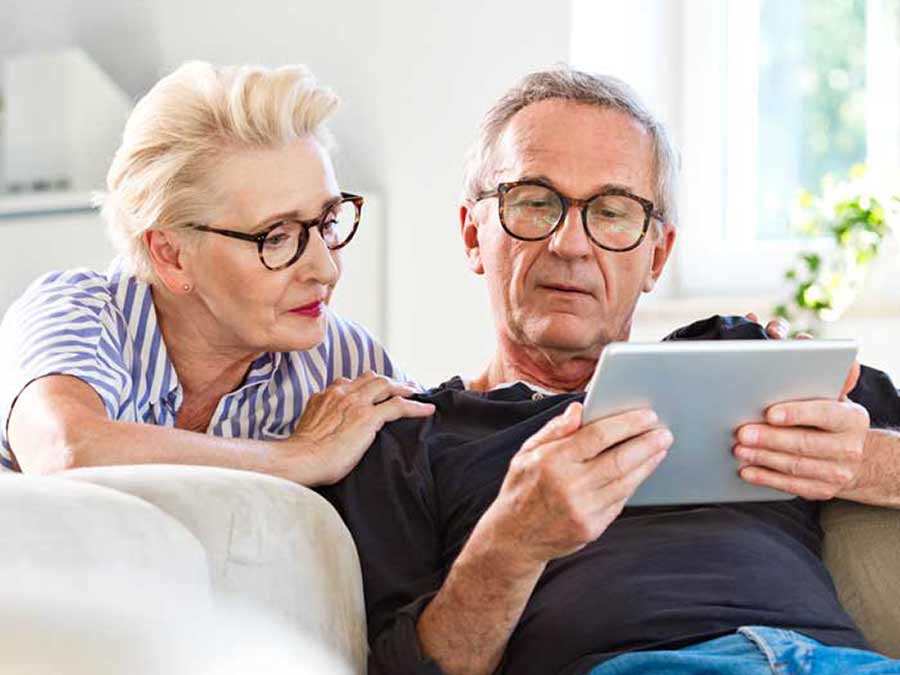 A couple booking a free annual check up online at Amplify Hearing